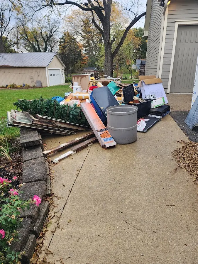Dumpster being loaded with debris for Residential Dumpster Rental in Beecher